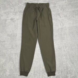 Lululemon On The Fly Jogger Pants Womens 2 Olive Green Drawstring Casual Gym Lux